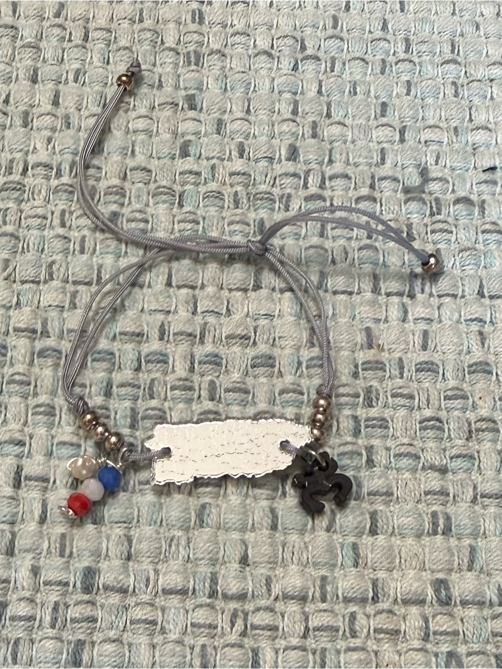 Adjustable Silver-Tone Charm Bracelet with Red, Blue & White Beads and PR map.